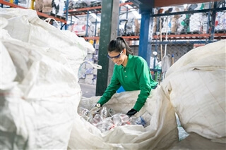 Woman sorting plastics